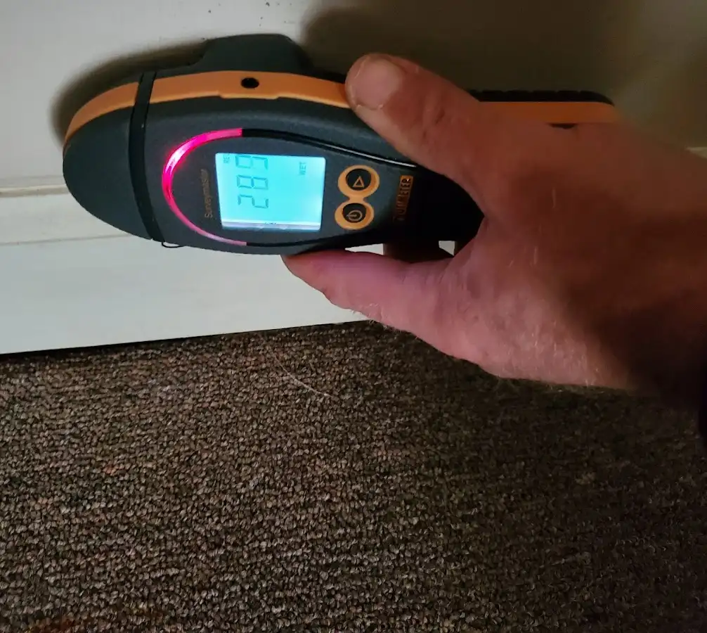 Moisture detection at baseboard during Storm Damage Restoration in Santa Cruz